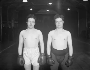 Boxers in duplicate. Jack ( in black trunks ) and Dick Gutteridge, the twin sons