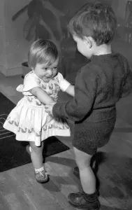 Celebration Prints: Boy and girl toddlers playing together dancing partners dance / dancing / party season