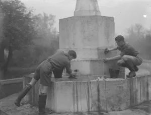 Two boy scouts clean the Chislehurst memorial, Kent. 1936