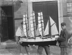Eccentric Prints: Boys hold up a model sailing ship at the handicraft exhibition in Dartford, Kent