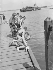 Ships Prints: Boys play by the steps on the River Thames at Gravesend, Kent. 1939