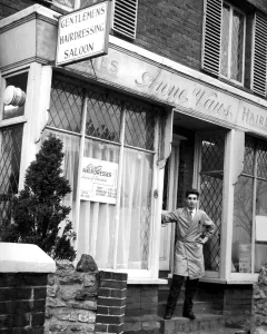 Brian Wells standing infront of his Barber Shop in London Road Westerham Kent. Twice