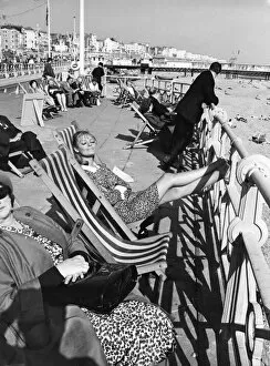 Holiday Collection: Brighton - enjoying the sunshine sitting in deckchairs on the Promenade at Brighton 28th