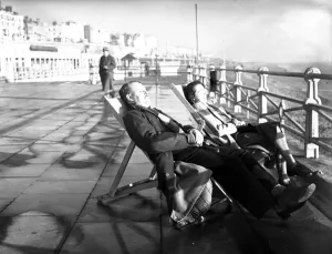 Beach Prints: Brighton Two people enjoying the sunshine on the front at Brighton 1 December 1948