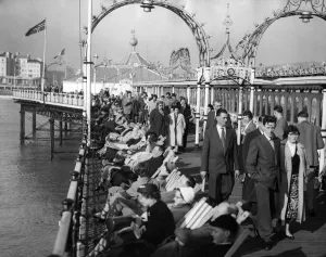 Beach Prints: Brighton Pier Crowds enjoying a spring like day after a long winter 1st March 1959