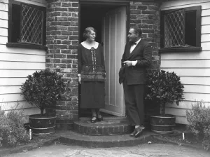 Actress Prints: British film stars, Mr Henry Edwards and Miss Chrissie White at their front door