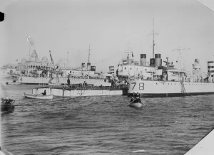 British warships on their way to China. HMS Aphis, river gunboat, alongside her escort