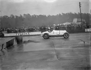 Spectators Prints: Brooklands races. Photo shows; Mr Whitney Straight speeding down the track. 28