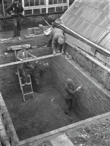 Preparation Prints: Building the outer foundations for an air raid shelter in a garden in Hextable