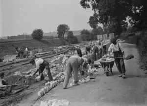 Building up wall with stone of Waterloo Bridge. St Mary Cray. 1937