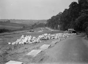 Building up wall with stone of Waterloo Bridge. St Mary Cray. 1937