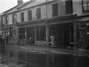 Fireman Collection: The burnt - out remains of a shop in Swanscombe, Kent after a fire
