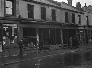 Fireman Collection: The burnt - out remains of shops in Swanscombe, Kent after a fire