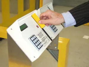 Business man entering a building using a swipe card. ?TopFoto
