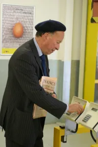 Business man entering a building using a swipe card. ?TopFoto