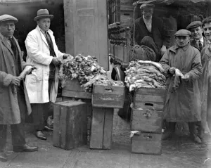 Market Prints: A busy scene at rabbit skin corner. Smithfield Market where thousands of skins