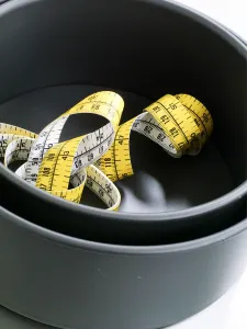 Sweet Prints: Cake tins and tape measure credit: Marie-Louise Avery / thePictureKitchen / TopFoto