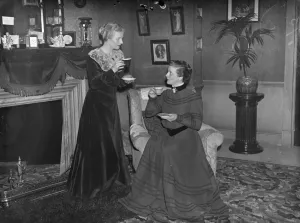 The two candidas Ann Harding whishes successor good luck in Shaw Play. In the costume