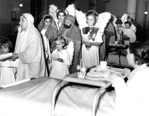 Nurses Prints: Carols around the wards - after the rehearsals of their nativity play the nurses