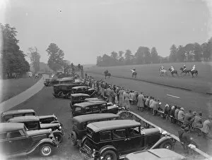 Spectator Collection: Cars parked by the grandstand at the horse polo game