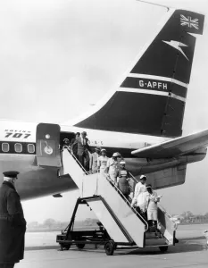 Chartered Boeing 707 jet airliners are flying in hundreds of coloured immigrants
