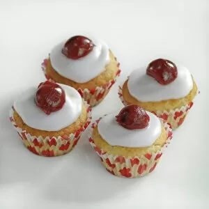 Foods Collection: Cherry topped mini muffins on white background credit: Marie-Louise Avery / thePictureKitchen