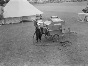Fancy Dress Prints: A child wins first prize dressed as an Auxiliary Fire Service firefighter. Here