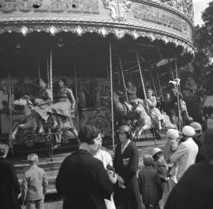 Fair Prints: Children on the carousel at a fair in Blackfen, Kent. 1936