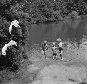 Children enjoy a paddling pool in Chislehurst, Kent. 1938