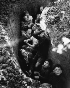 Wartime Prints: Children of the hop pickers take shelter to watch the Battle of Britain rage overhead