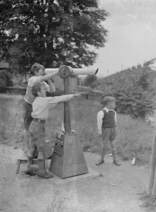 Playing Prints: Children looking through telescope. 1937