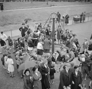 Parents Prints: Children playing on the top hat roundabout at the childrens playground in Crayford