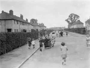 Houses Prints: Children use prams to carry home firewood in Sidcup, Kent. 1938