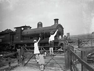 Rural Life Collection: children waving to the train driver. 1936