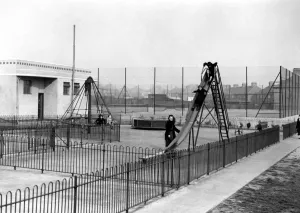 Parents Prints: The childrens playground : a mother takes her children to play on the deserted slide