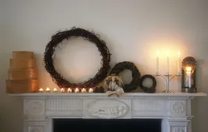 Decorative Prints: Chimney piece in pale interior with shaker style chritmas decorations and objects