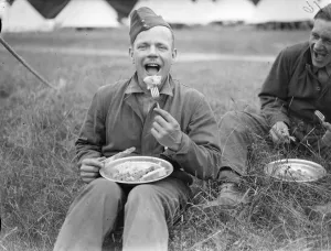 Food Prints: One of the civilian guests enjoying a meal. 15 young men from south London are spending