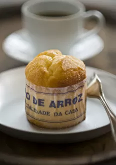 Wood Collection: Classic Portuguese muffin type cake made with rice in paper wrapper on metal plate