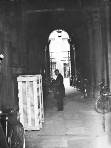 General Topography Prints: A cleaner sweeping the archers between Downing Street and the foreign office quadrangle today