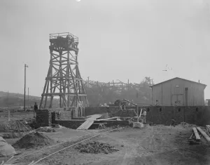 Coal from war wrecked coalfield of Lens. A new shaft head and winder nearly completed