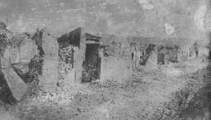 Coal from war wrecked coalfield of Lens. A ruined street in Lens which is to be