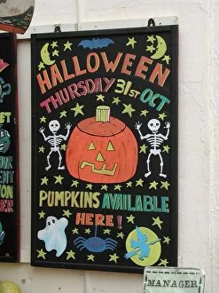 Images Dated 25th September 2015: Colourful blackboard with artistic Hallowe en advertisement for pumpkins, Deal, Kent