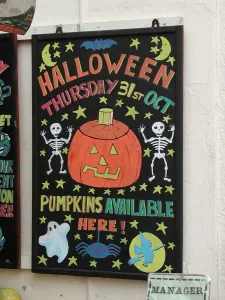 Hallow Prints: Colourful blackboard with artistic Hallowe en advertisement for pumpkins, Deal, Kent