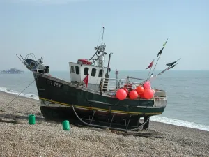 Shingle Prints: Colourful red buoys on moored fishing boat, Walmer beach, Kent, England