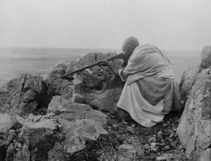 Concerned in the Peshawar trouble. A typical Afridi sniper behind the rocks. 7