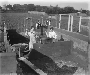 Construction Prints: Concrete Houses at Harlow, Essex Girls filling the mould, in the background are