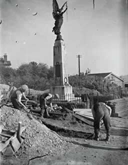 Worker Collection: The construction of an Air Raid Precautions shelter beneath a war memorial in Swanley