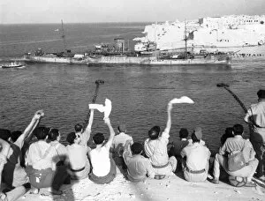 Waving Collection: The convoy entering the harbour. Troops wave and cheer as more boats of the convoy