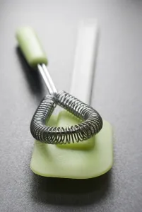 Kitchen Prints: Cookery equipment, , wire whisk and green plastic and silicone spatula credit: Marie-Louise