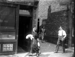 Bakery Prints: Cooking dinner at Limehouse, London. 1933
